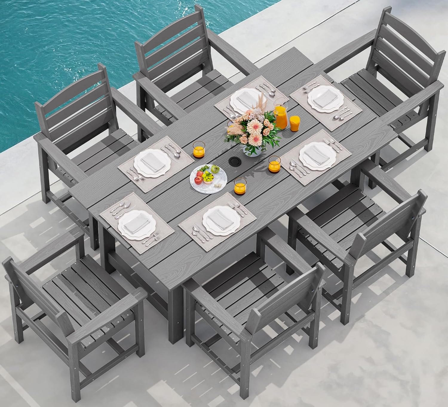 Dining table and chair set. 7-piece outdoor dining set, including a table with an umbrella hole and six chairs.