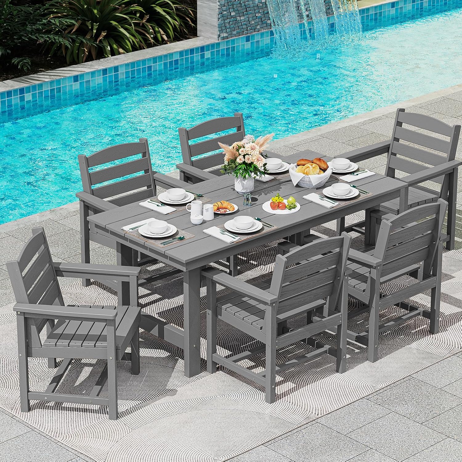 Dining table and chair set. 7-piece outdoor dining set, including a table with an umbrella hole and six chairs.